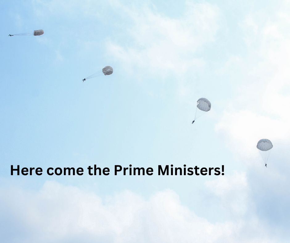 Armageddon - a blue cloudy sky with four parachutists and the words Her come the Prime Ministers