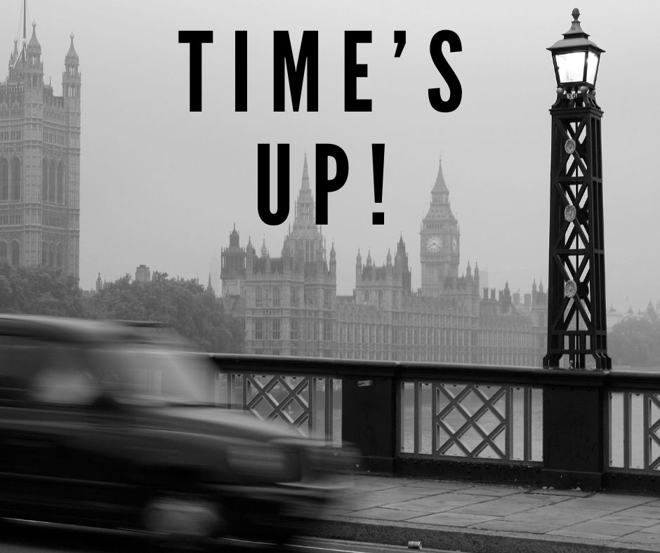 blurred image of a black cab crossing a London Bridge with Houses of Parliament in the background - Taxi For Sunak