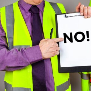 close up of a man in a hi-viz vest holding a clipboard that says 'No'.